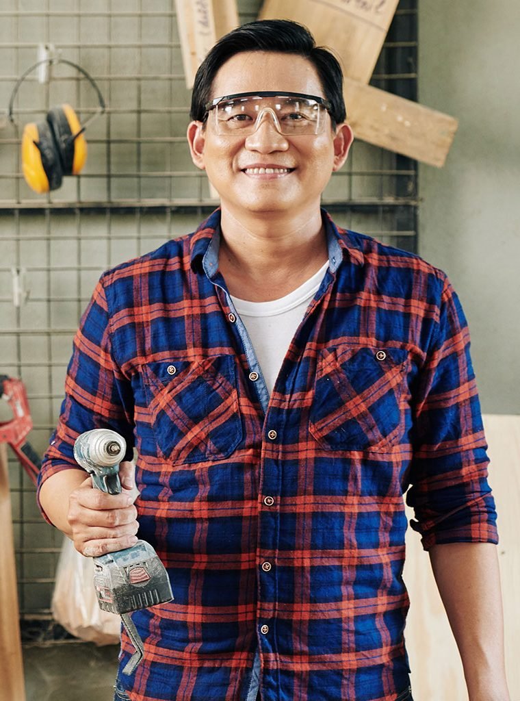 mature-carpenter-with-electric-drill-NGH3CQQ.jpg